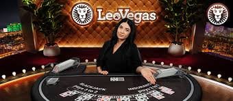 Live dealer revealing banker hand tiles
